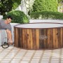 LAY-Z-SPA Helsinki AirJet Whirlpool (Ø 180cm) mit Pumpe in Holzoptik beim Aufbau im Garten.