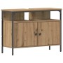 Waschbeckenschrank Artisan-Eiche aus Holzwerkstoff mit schwarzem Metallrahmen, 2 Türen und offener Ablage für Bad.