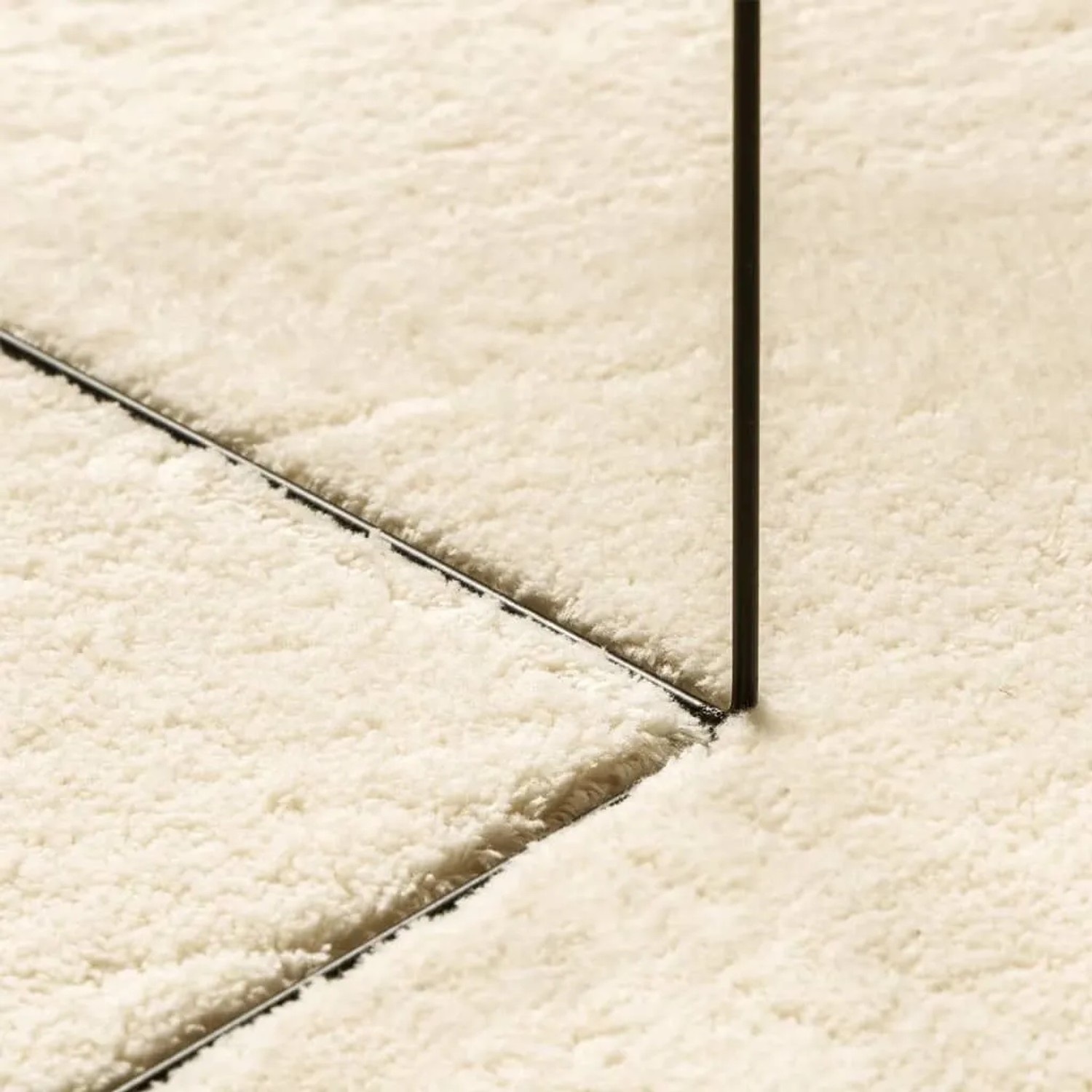 Detailansicht: Cremefarbener, waschbarer Kurzflorteppich HUARTE, Ø 200 cm.