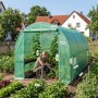 Grünes Sekey Foliengewächshaus 3x2x2m im Garten. Frau pflegt Tomaten. Stabil, UV-Schutz, mit Türen und Fenstern.