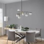 Anthrazitfarbene Erismann Vliestapete Spotlight InStyle im Raum mit Lampe.