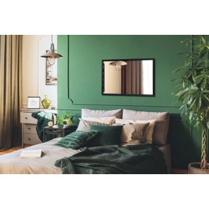 Rechteckiger Wallfluent Spiegel mit schwarzem Rahmen an grüner Wand im Schlafzimmer. Ideal als Wandspiegel oder Badspiegel.