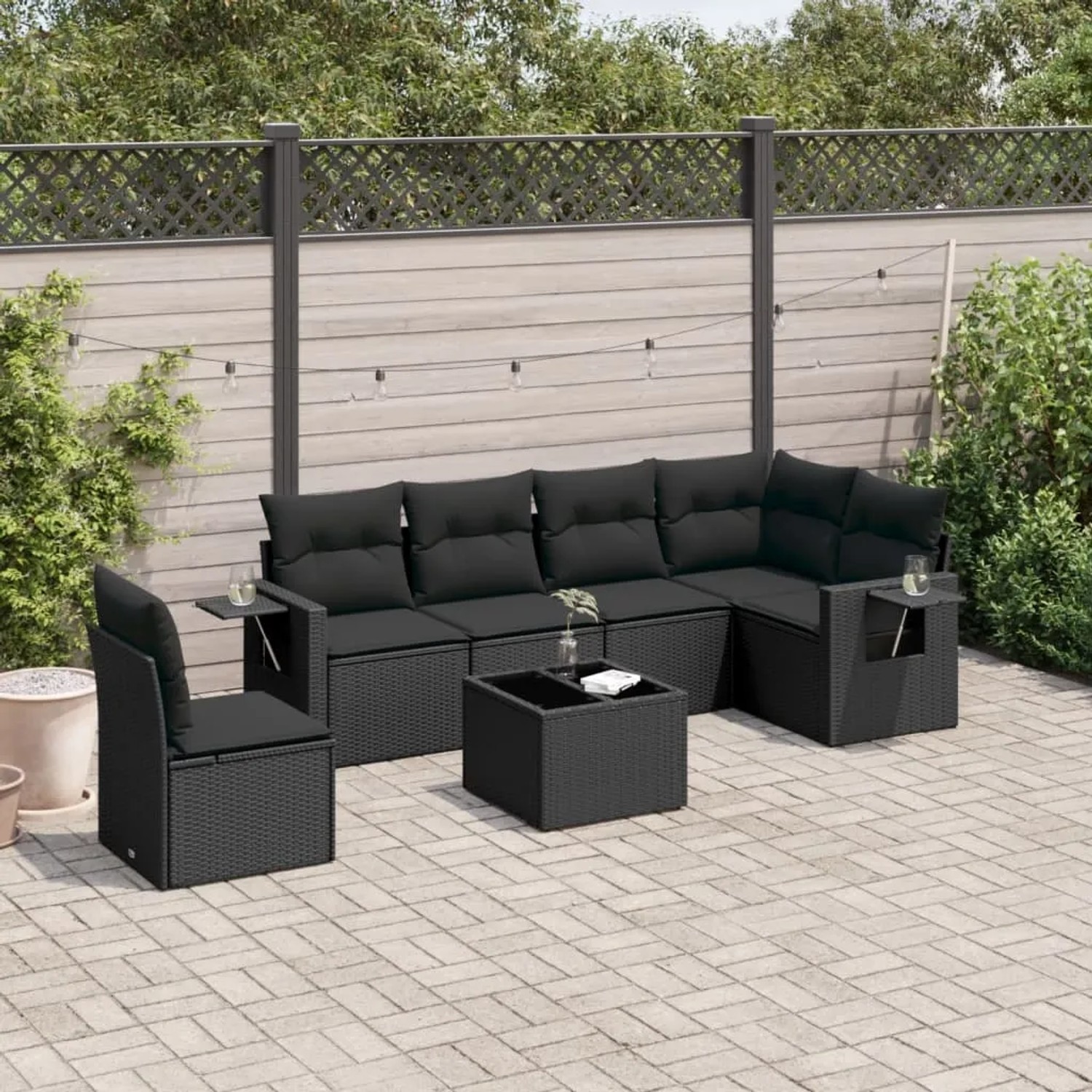 Schwarze 7-tlg. vidaXL Garten-Sofagarnitur aus Poly Rattan mit Kissen und Tisch.