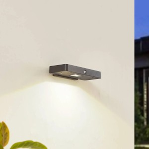 Moderne, dimmbare Lucande LED Solar-Wandleuchte Tavon in Schwarz mit Bewegungsmelder.