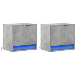 Zwei betongraue Wand-Nachttische mit je einer Schublade und blauer LED-Beleuchtung.