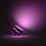 Philips Hue Iris Tischleuchte, schwarz, mit farbigem Lichtschein.