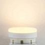 Runde, weiße Arcchio GX53 LED Lampe 10W, leuchtend mit warmweißem Licht. Kunststoff-Leuchtmittel, 7,5 cm Durchmesser.