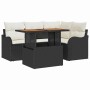 Schwarzes 5-teiliges Gartenmöbel Set aus Rattan mit Tisch und Polster.