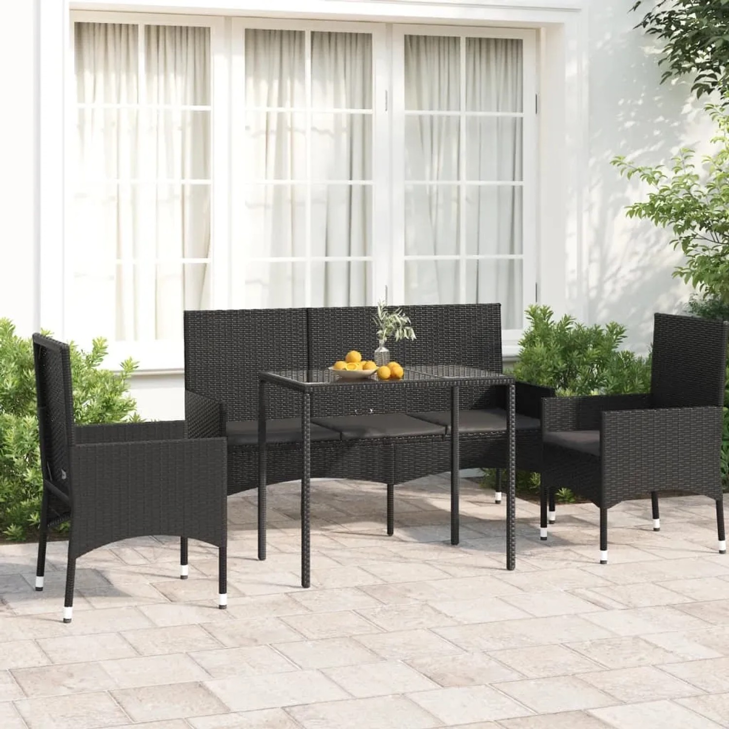 Schwarzes 4-tlg. Garten Lounge Set aus Rattan mit Tisch, Bank und Stühlen.