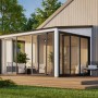 Modernes, weißes Palmako Holz-Gartenhaus mit Pultdach und großen Glasfronten. Ideal als Gartenpavillon oder Geräteschuppen.