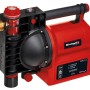 Einhell GE-AW 1042 FS Hauswasserautomat: Rote Gartenpumpe mit schwarzem Griff und Vorfilter.