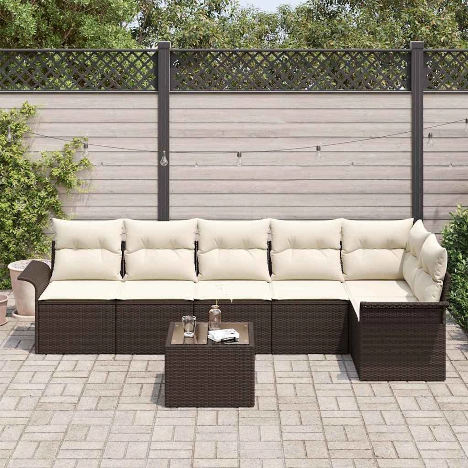 6-teiliges Garten-Sofa-Set aus grauem Poly Rattan mit Kissen und Tisch.