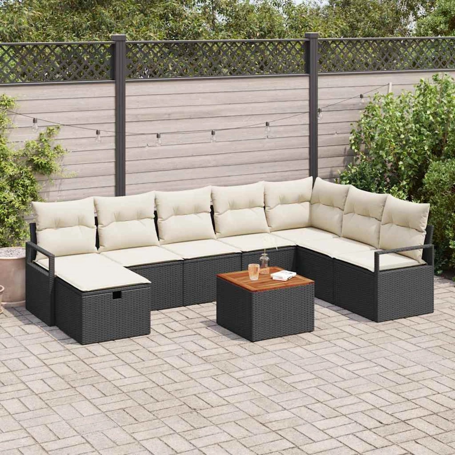Schwarzes 9-teiliges vidaXL Garten-Sofa-Set aus Poly Rattan mit Kissen.