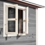 Detailansicht: Graues EXIT Loft 350 Holzspielhaus mit geöffnetem Fenster.