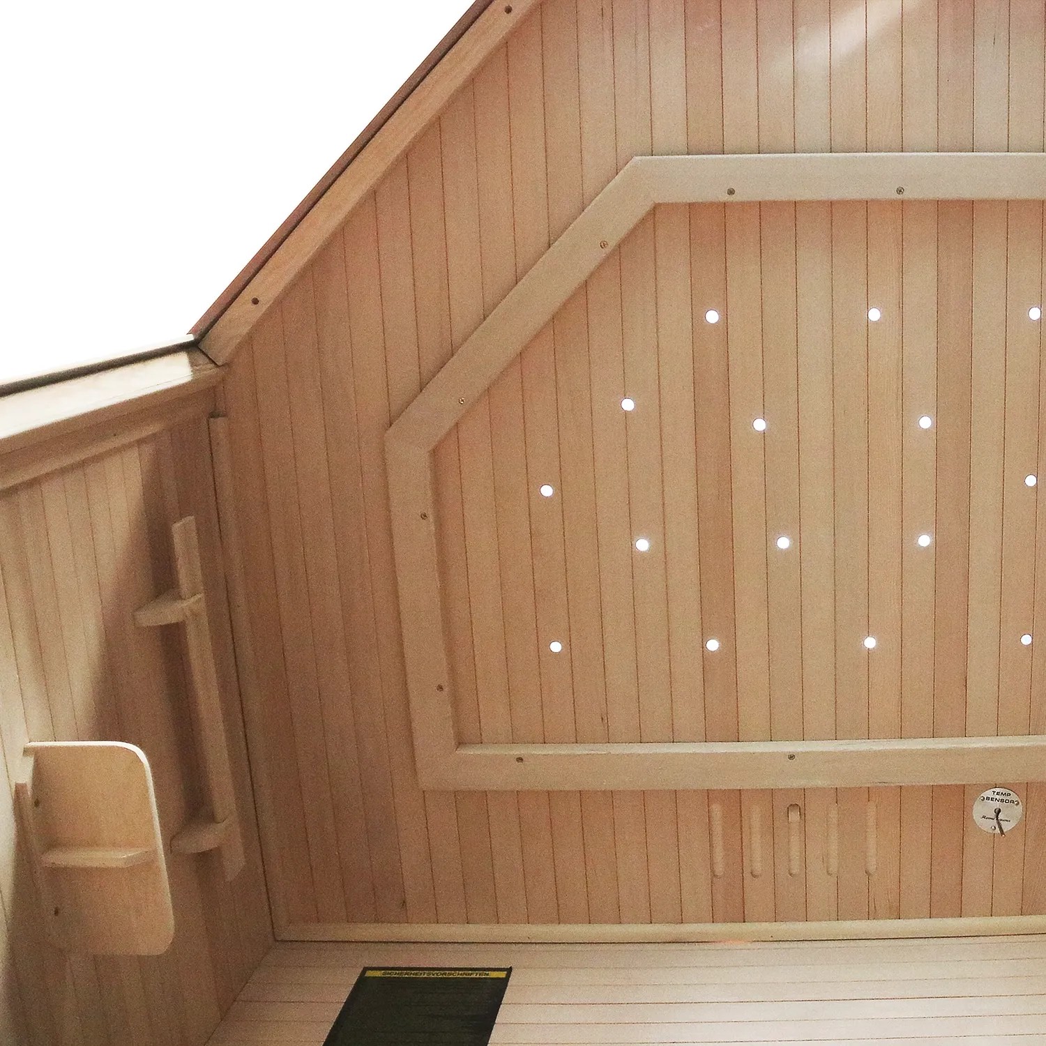 Innenansicht der Dewello Infrarotkabine Ottawa aus Hemlock-Holz mit Sternenhimmel und Sitzbank.