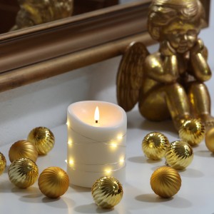 Cremefarbene FlowerPower LED-Echtwachskerze Corro Elephant, Ø 10 cm, mit Lichterkette.