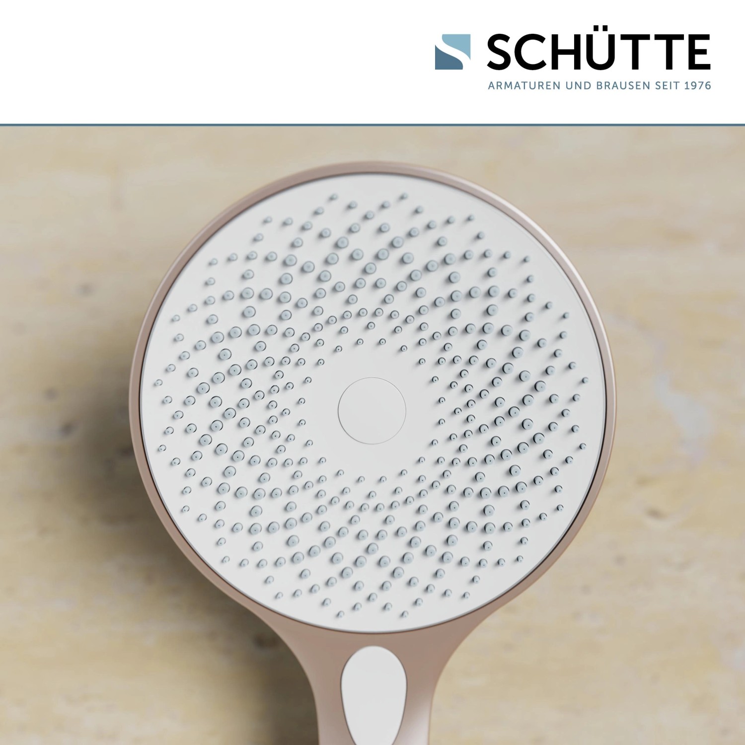 Schütte Handbrause Capri, rosé matt/weiß, Nahaufnahme der Brausefläche mit Antikalk-Noppen.