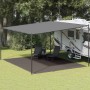 Anthrazitfarbener Zeltteppich unter einer grauen Markise neben einem Wohnwagen. Ideal für Camping & Outdoor-Bereich.