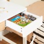Weißer SoBuy Schreibtisch FWT106-W mit Schublade, gefüllt mit Spielzeug und Buch.