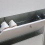 Weißer ebuy24 Schuhschrank Escape mit vier Klappen, teilweise geöffnet mit Schuhen.