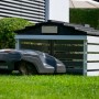Dobar Mährobotergarage mit schwarz-weißem Design und abnehmbarem Dach.