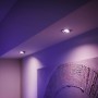 Zwei Philips Hue Centura LED-Einbauspots in Aluminium, die ein violettes Licht abstrahlen.