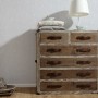 A.S. Creation Vliestapete Avanti Uni Grau an Wand hinter Kommode und Deko.