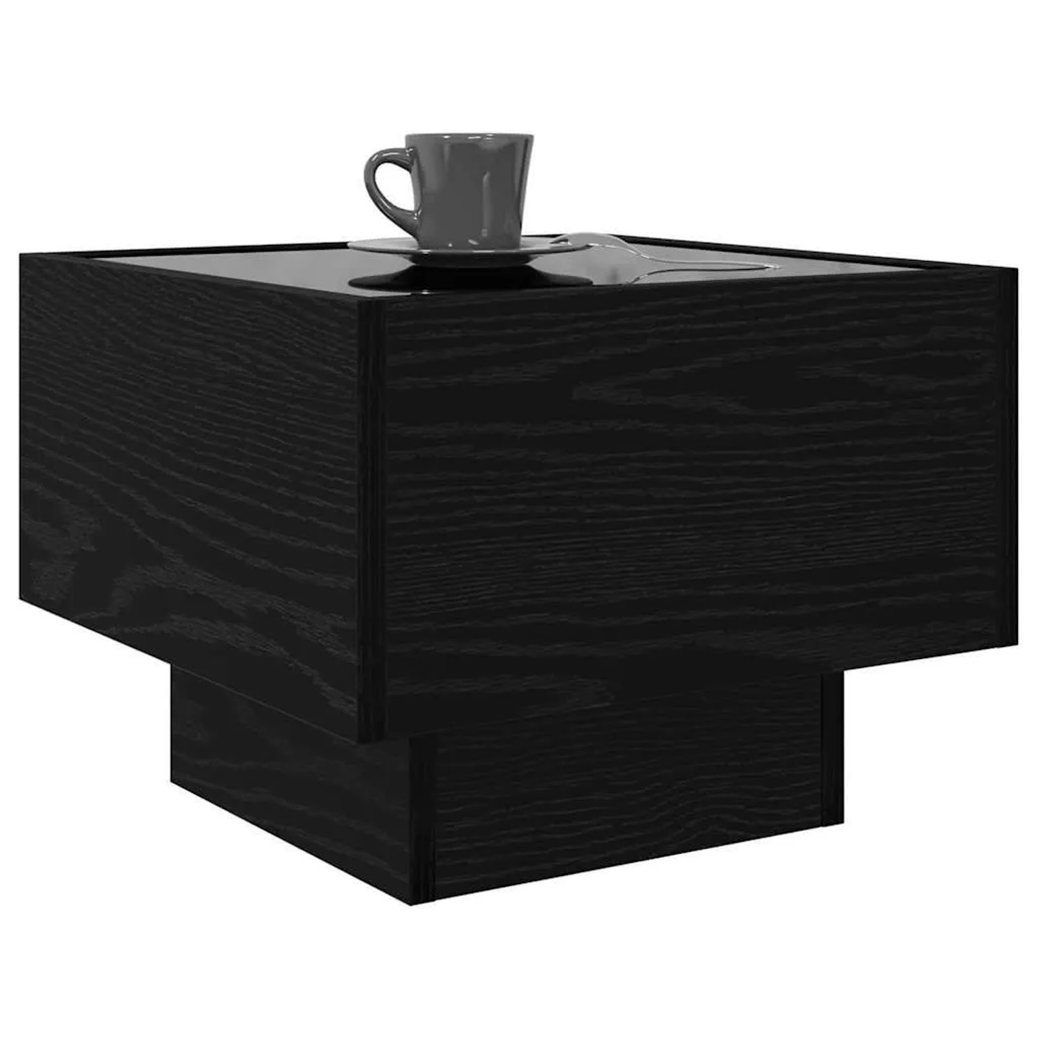 Quadratischer, schwarzer Couchtisch in Eichen-Optik mit Tasse als Deko.