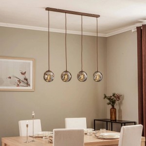 Moderne Lindby Pendelleuchte Valentina, 4-flammig, aus Glas und Alu über Esstisch.