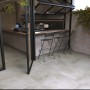 Terrassenplatten Feinsteinzeug Vero 2.0 in Zementoptik Grau, 80x80 cm, verlegt im Außenbereich.