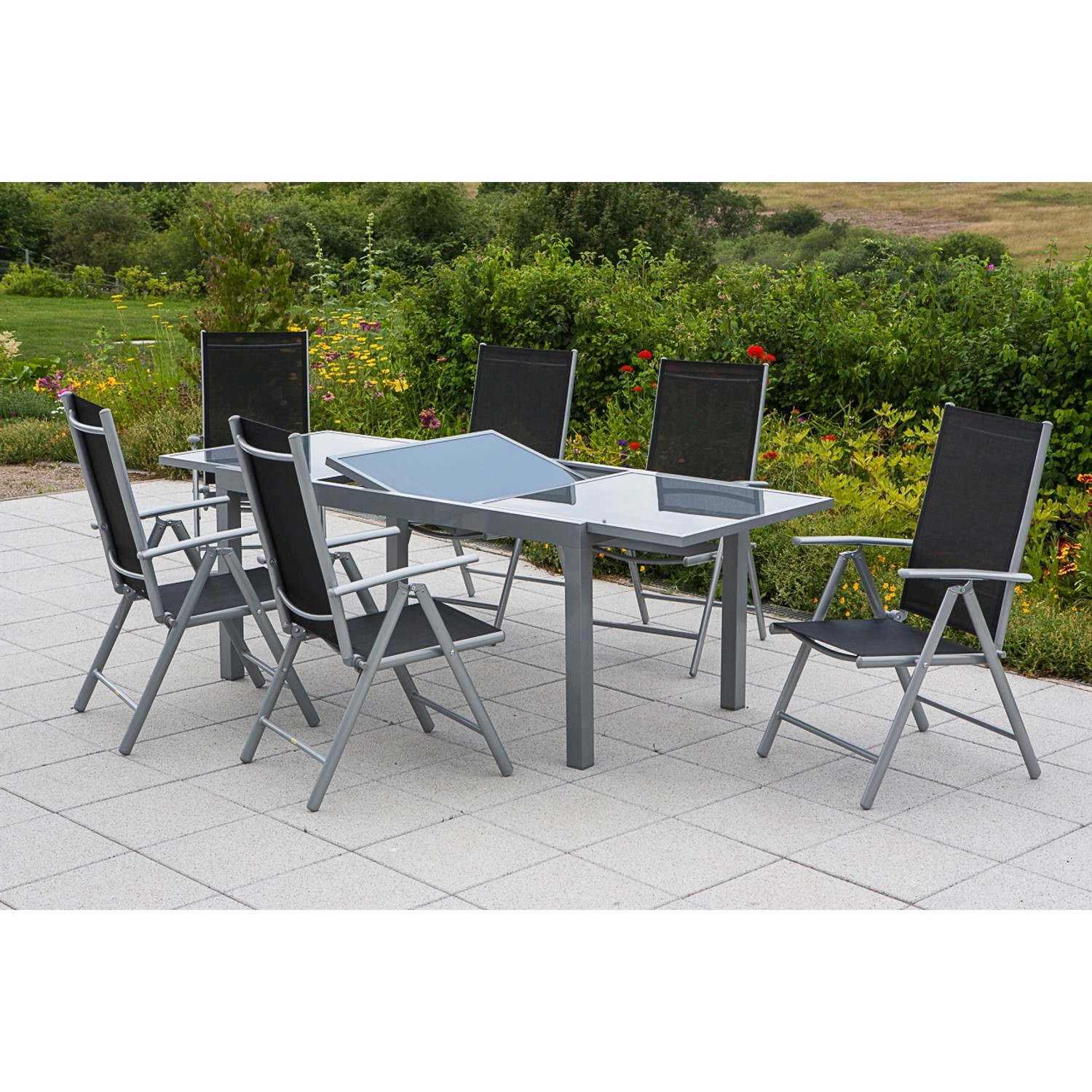 Merxx Gartenmöbel-Set Amalfi, 7-teilig, mit Ausziehtisch und 6 Klappsesseln in Schwarz/Grau.