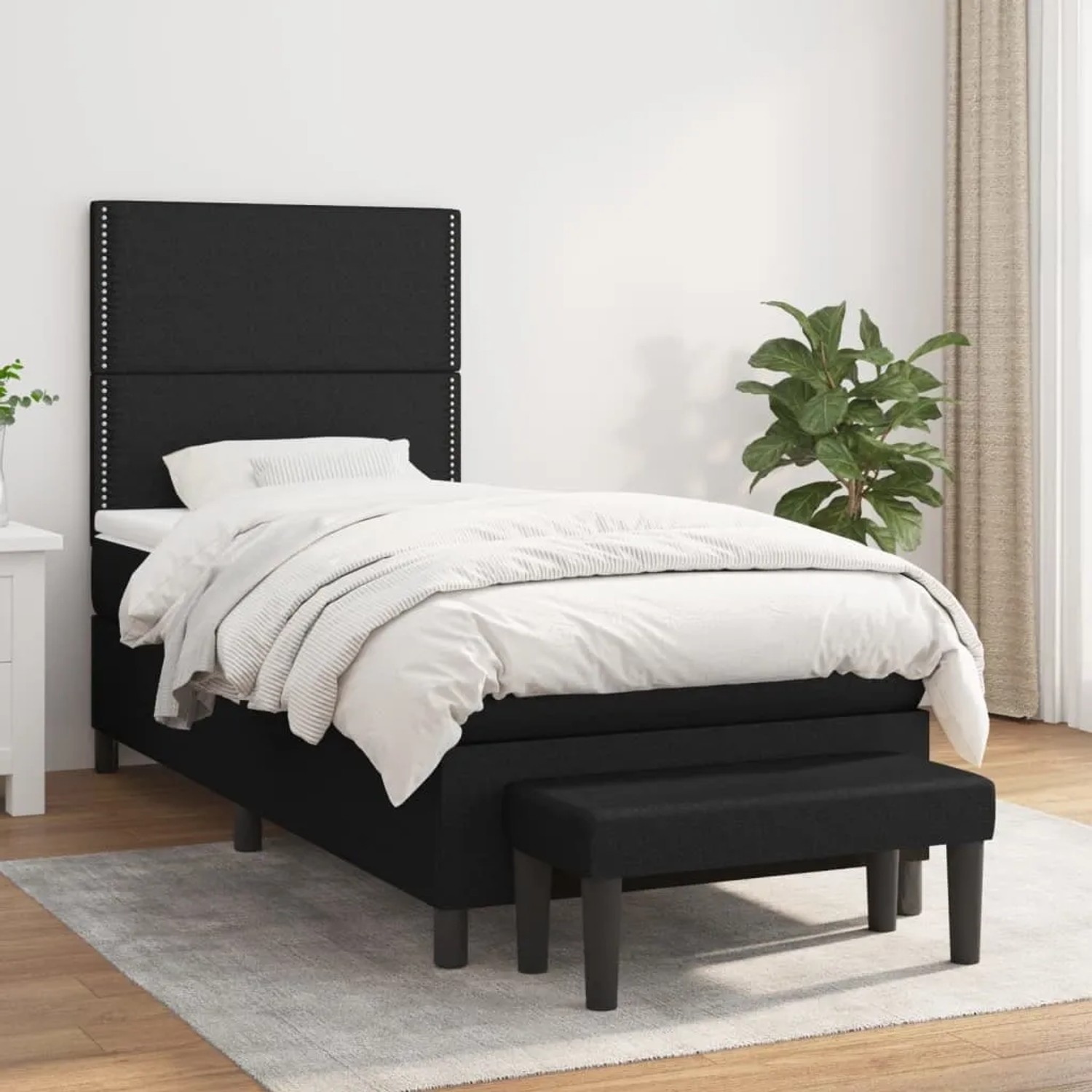 Schwarzes Boxspringbett (90x190 cm) mit Matratze und Bank, Stoffbezug.