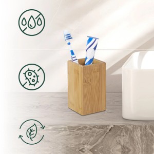 Quadratischer Zahnputzbecher aus Bambus mit Zahnbürste und Zahnpasta. Naturfarben, beschichtet.