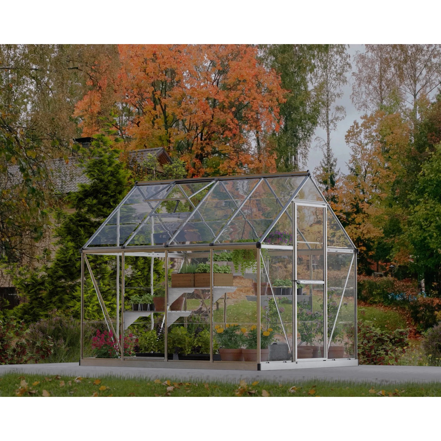 Palram Canopia Gewächshaus Silber 4,6 m² mit Fundamentrahmen im Garten.