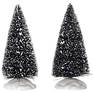 Weihnachtsdekoration: Zwei kleine, schneebedeckte Tannenbäume für ein Winterdorf.