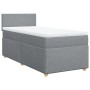 Hellgraues vidaXL Boxspringbett 90x200 cm mit Matratze und weißem Topper.
