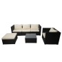 Schwarze Poly-Rattan Gartenmöbel-Garnitur Busto: Sofa, Sessel, Hocker, Glastisch mit cremefarbenen Kissen.