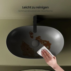 Reinigung eines grauen Emke Aufsatzwaschbeckens aus Keramik mit ovaler Form.