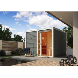 Karibu Saunahaus Jasper mit Schiebetür und bronzierter Glastür im Garten.