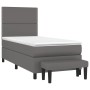 Graues Boxspringbett mit Matratze, Kopfteil und Bank aus Kunstleder, 90x200 cm.