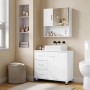 Weißer Waschbeckenunterschrank mit 3 Schubladen und Tür, modernem Aufsatzwaschbecken und Spiegelschrank im Bad.