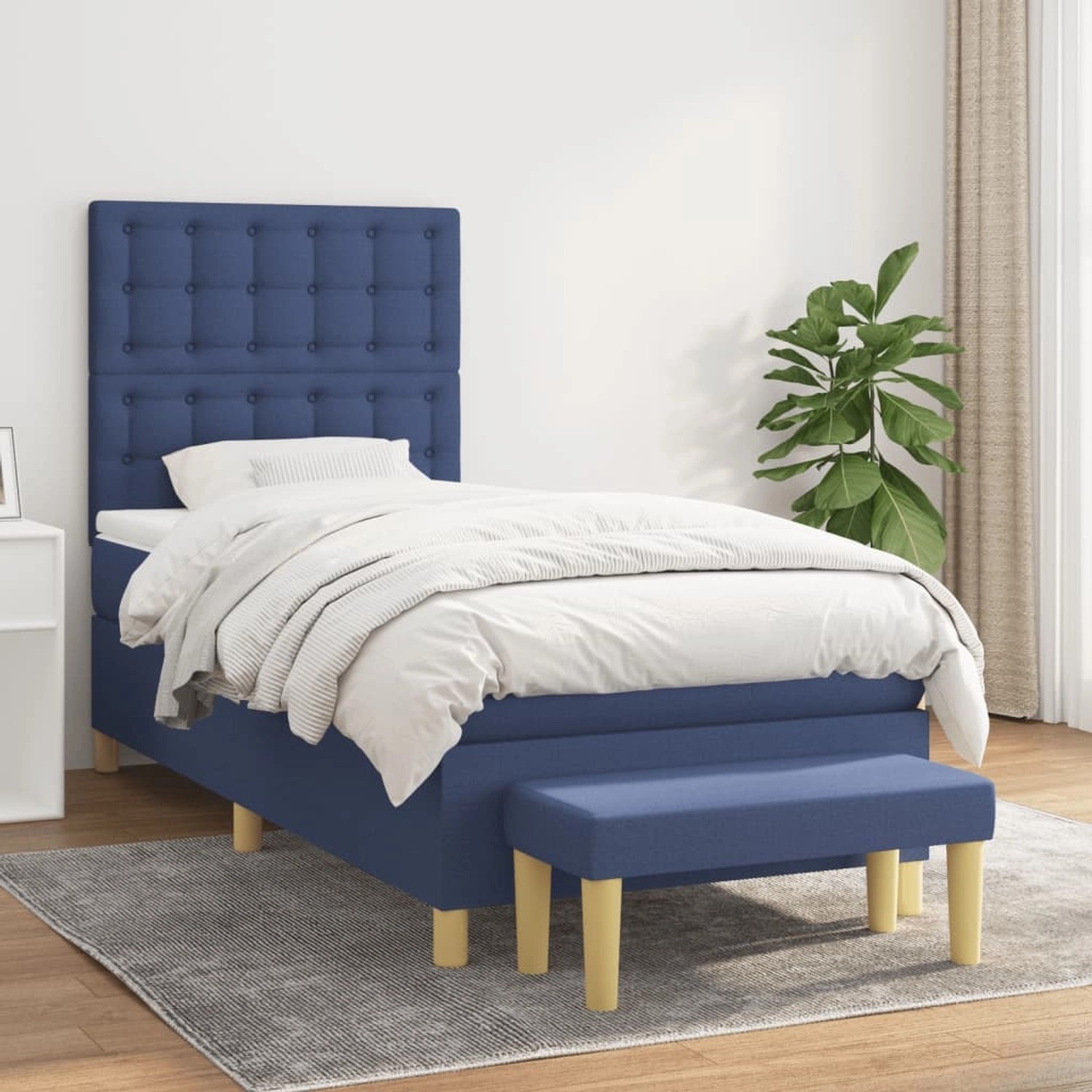 Blaues Boxspringbett (90x200 cm) mit Matratze, Kopfteil und Bank.