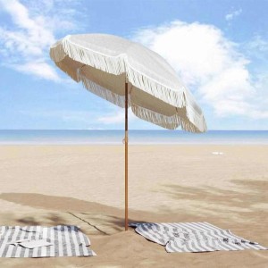 Grau-weißer vidaXL Sonnenschirm (Ø 160 cm) am Strand mit Fransen und Stahlmast.