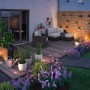 Beleuchtete Terrasse mit Paulmann LED Bodeneinbaustrahlern und Gartenmöbeln.