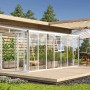 Weißes Vitavia Gewächshaus Athena 11900 ESG/HKP mit Glasfront und Pflanzen auf einer Holzterrasse.