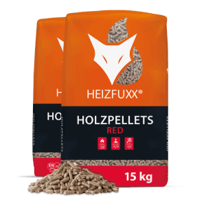 Zwei orange Heizfuxx Holzpellets Red Säcke (je 15kg) mit Pellets. Brennstoffe für Heizsysteme.