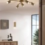Moderne Trio Wandleuchte Marley, 2-flammig in Altmessing im Wohnraum.