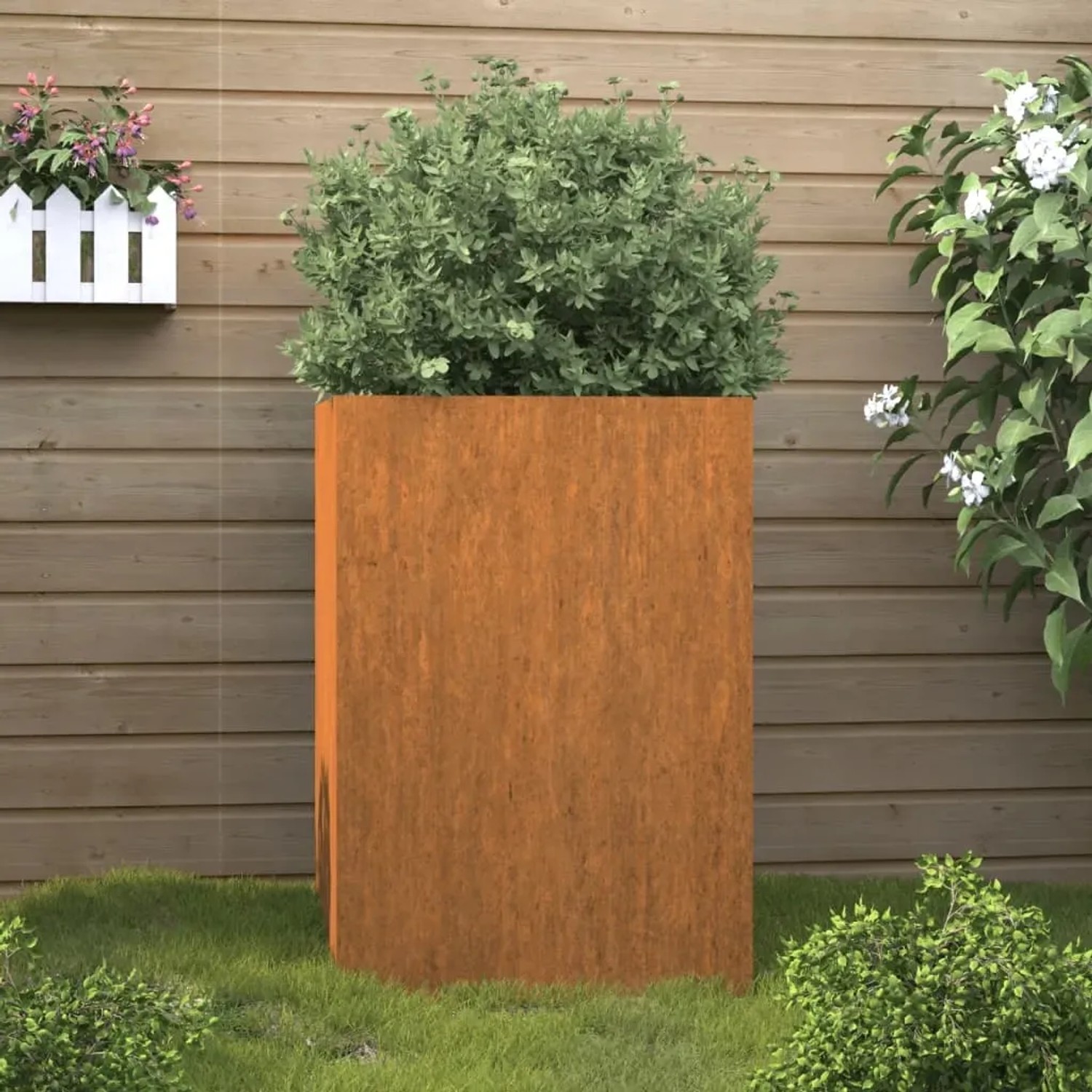 Rechteckiger vidaXL Pflanzkübel aus rostigem Cortenstahl mit grüner Pflanze. Ideal für Garten, Balkon, Terrasse.