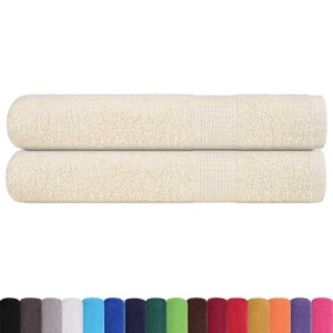 Zwei creme Saunatücher (80x200 cm) aus 100% Baumwolle, gestapelt.