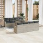 Hellgraues 7-teiliges Garten-Sofa-Set aus Poly Rattan mit Tisch und Kissen.